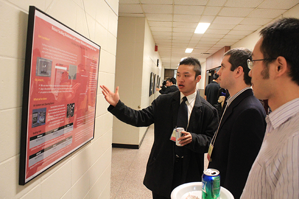 Xin Wang, a master's student in geotechnical/materials engineering, presents at the 4th Annual CCEE Graduate Research Showcase and Poster Competition, held Dec. 2 at the Town Engineering Building.