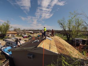 AGC members work on a roofing project