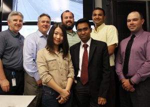 Huang (front left), Chakraborty (front right), Sharma (second from right in back) and Barrette (back right) stand with REACTOR Lab Team at InTrans