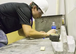 Levandowski measures ISU CCEE team beam prior to testing (Photo by Kate Tindall)