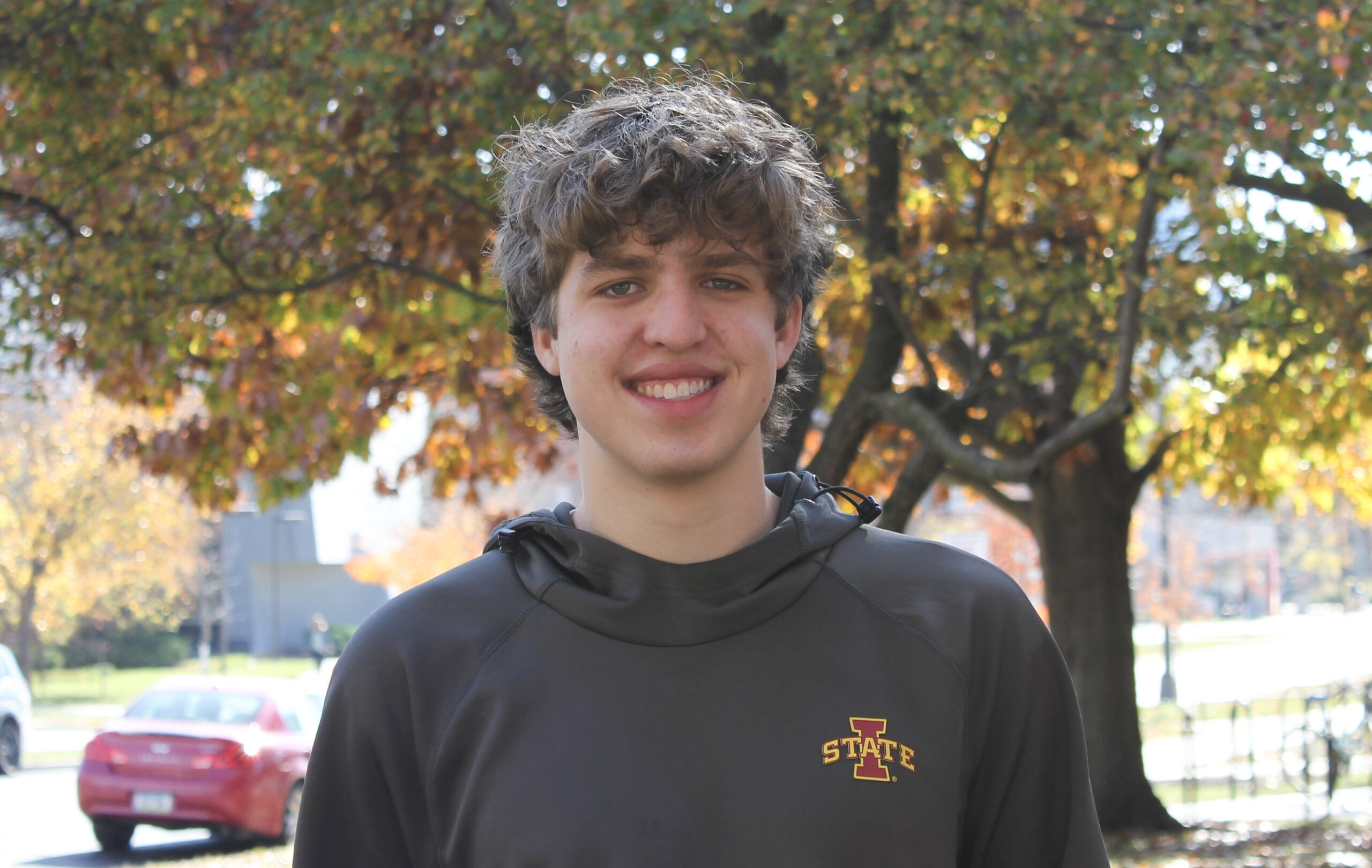 Ben Johnson smiling in front of tree outside of Town Engineering building.